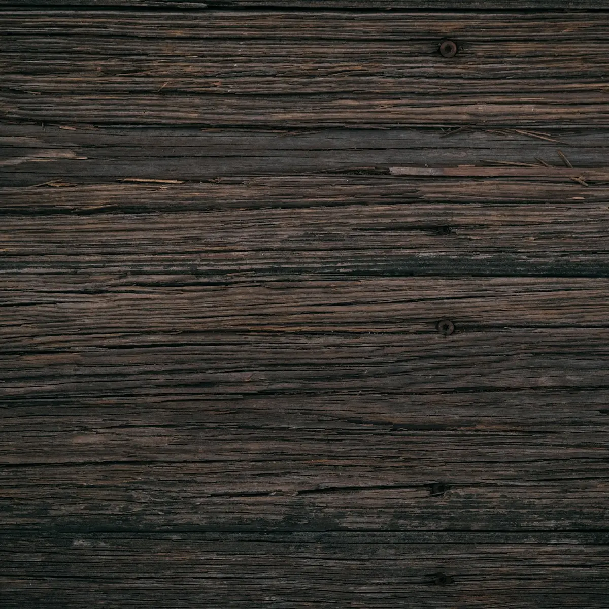 Charred boards weathered to silver-grey