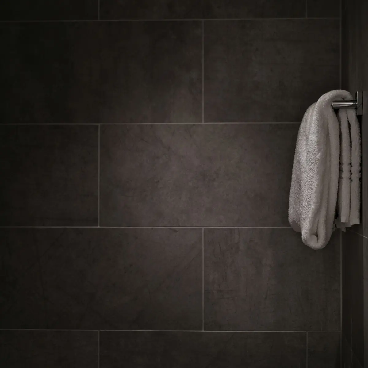 Large-format charcoal bathroom tiles