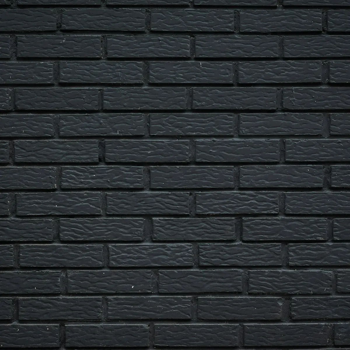 Black painted brick wall