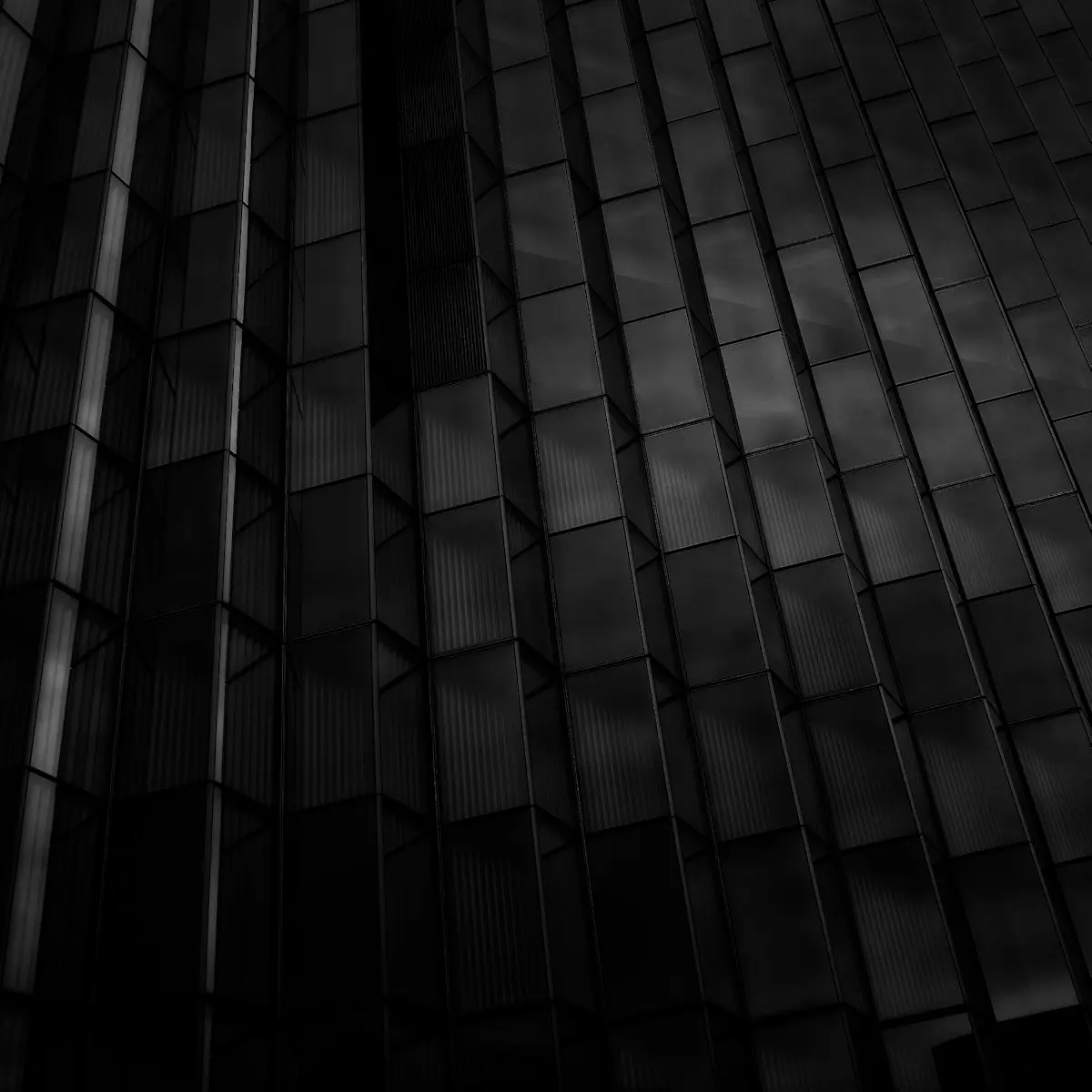 Smoked glass panels in raking light