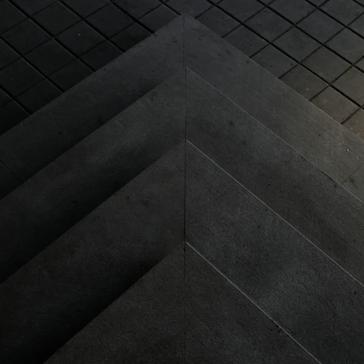 Charcoal granite steps cut in a chevron