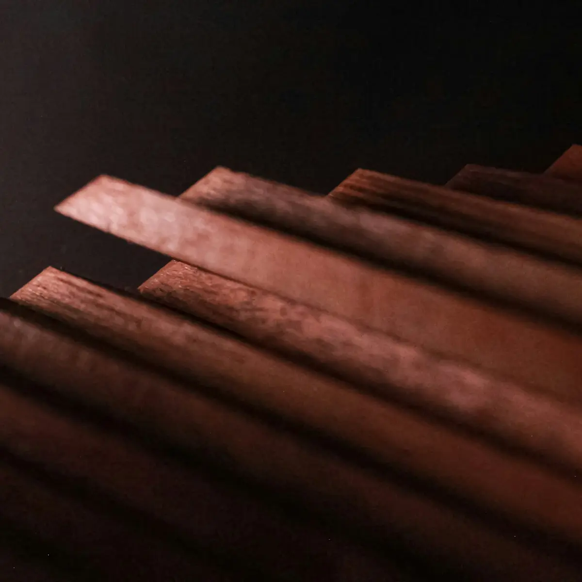 Sculpted hardwood lining with shadowed ridges